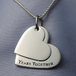 This double heart pendant is perfect for celebrating a special retirement. For all our Years Together is a perfect way to celebrate a special retirement. Engrave front and back of small heart (charm1). And, back of large heart (charm2. Ideas: Personalize small top heart - For All Our Personalize back of larger bottom heart - 1999-2009 (on line 1) Company Name (Line 2)