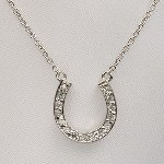 Our Tiffany style horse shoe necklace in sterling silver offers love and wishes of luck to a family member or friend. Great for graduation gifts, retirement gifts, or birthday gifts. Sterling - neck chain length is 16 inches. 