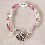 Personalized Awareness Heart Bracelet - Engraved Breast Cancer Awareness Bracelet Show your support for all those fighting this disease and remember those close to your heart who have moved on with this beautiful Personalized Pink Ribbon Awareness Heart Bracelet. A lovely accessory which looks fabulous with any outfit.