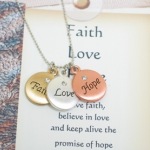 Have faith, believe in love and keep alive the promise of hope is the message of this special necklace. Three toned Faith Love Hope necklace with crystal bead in the center makes a great gift idea for communions, confirmations, sponsor gifts, godmother gifts or inspirational gift ideas. 