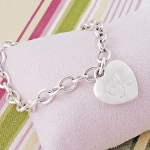 Youll get a designer look at an extraordinary price with our Personalized Heavy Weight Charm Bracelet. Crafted of sturdy, sterling silver-plated links, this trendy bracelet is finished with a classic stand out heart charm and free personalization... great for any gift giving occasion! Includes a free organza gift pouch. 