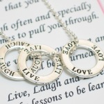 Let the Live Laugh Love Ring Necklace be a reminder of important things that we should do every day. The Necklace makes a inspirational gift idea for holidays, graduations, birthdays or as a special gift any time of year. 18" ball chain with silver finishes. Each gift arrives boxed with the Live Laugh Love Poem Card. 