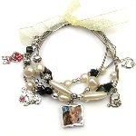 Show mom just how much you love her with this fun stretch charm bracelet. This four strand bracelet has a reversible photo charm (photos appear on both sides). instructions included. Let mom know just how charming she is.